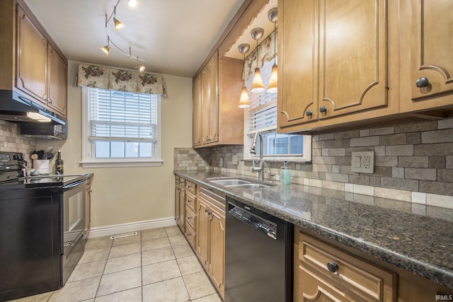 kitchen with decorative backsplash, light tile patterned floors, sink, and black appliances