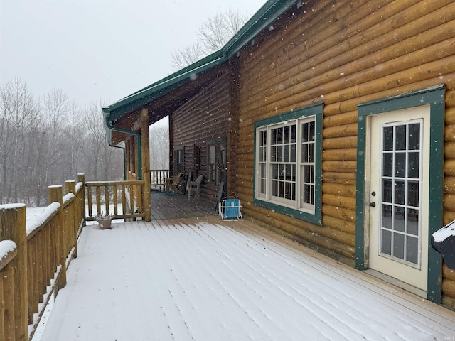 view of snow covered deck