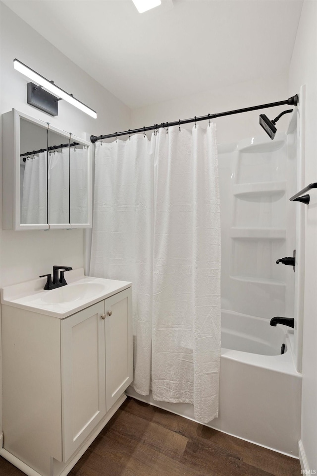 bathroom with vanity, shower / bath combo, and hardwood / wood-style flooring