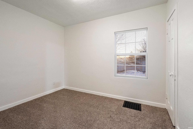 unfurnished room featuring carpet floors