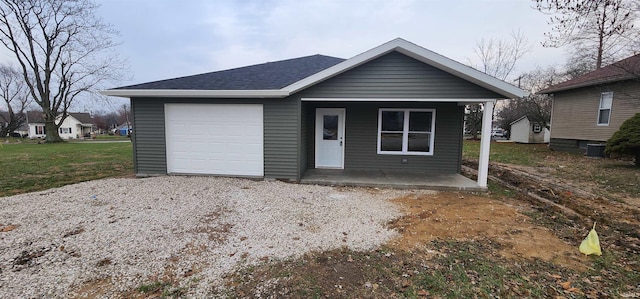 bungalow-style home featuring a porch and roof with shingles