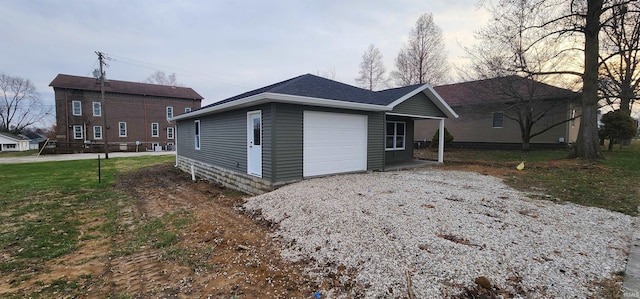 view of front of home with driveway, a front yard, and an attached garage