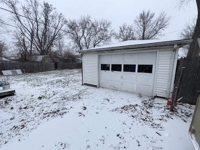 view of snow covered garage