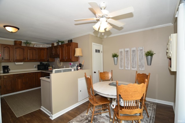 dining area featuring dark hardwood / wood-style floors, ceiling fan, and ornamental molding