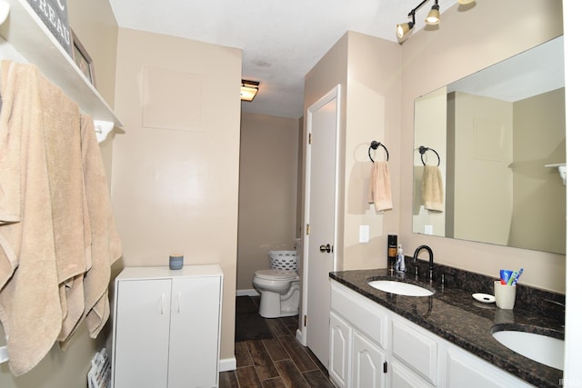 bathroom with vanity and toilet