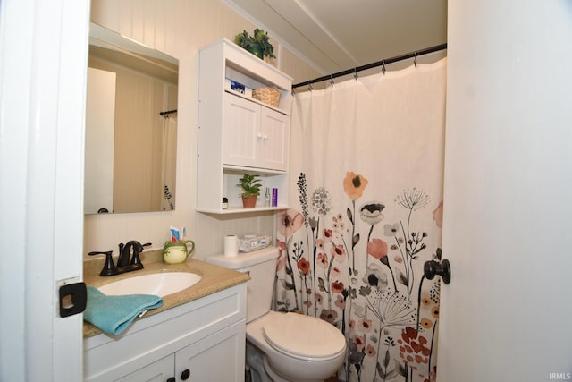 bathroom featuring vanity, a shower with shower curtain, and toilet