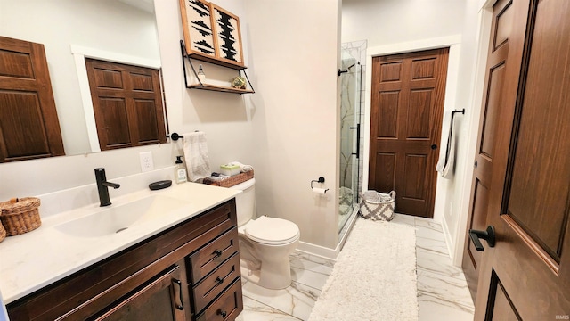 bathroom with a shower with door, vanity, and toilet