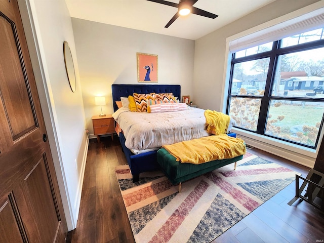 bedroom featuring ceiling fan and dark wood-type flooring