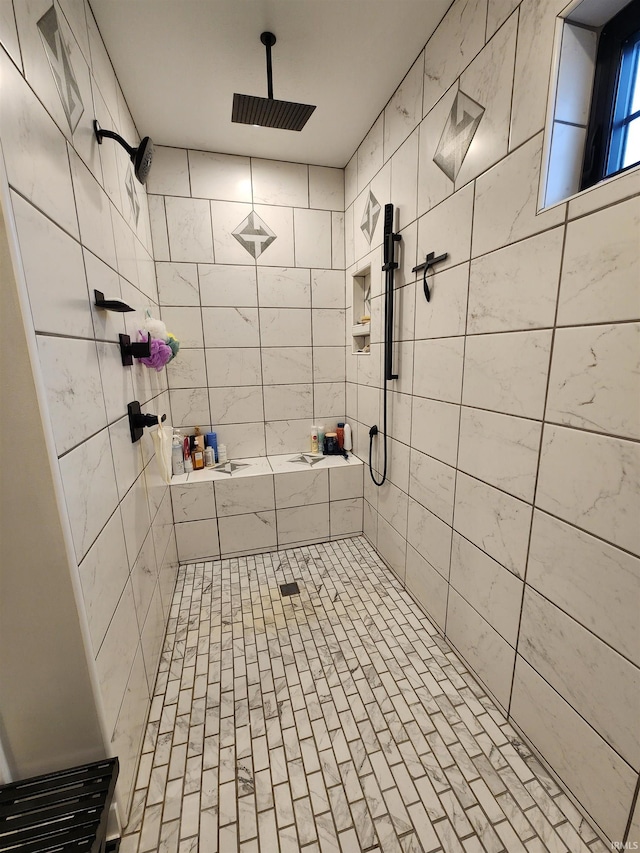 bathroom with a tile shower