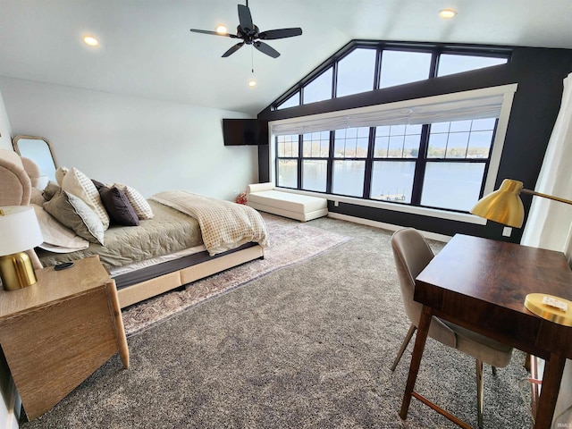 carpeted bedroom with multiple windows, ceiling fan, and lofted ceiling