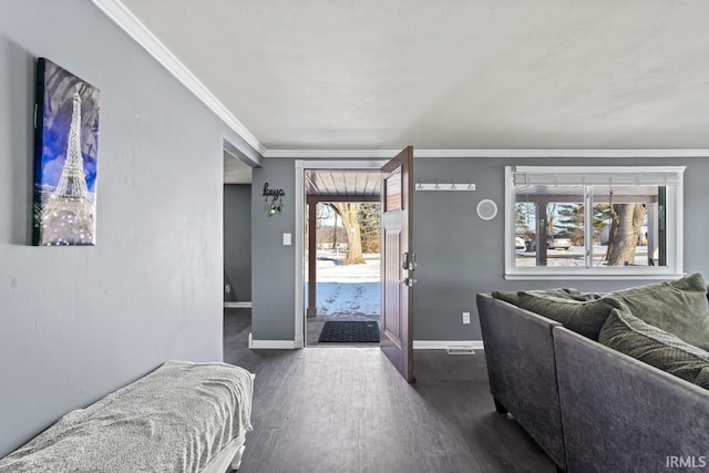 interior space with dark hardwood / wood-style flooring, a wealth of natural light, and crown molding