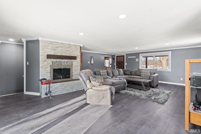 living room with a fireplace, dark hardwood / wood-style floors, and crown molding