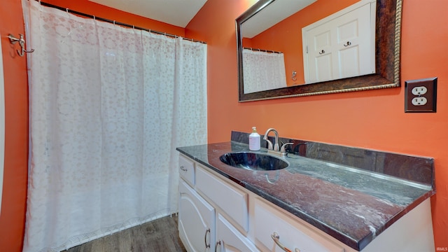 bathroom featuring hardwood / wood-style floors and vanity