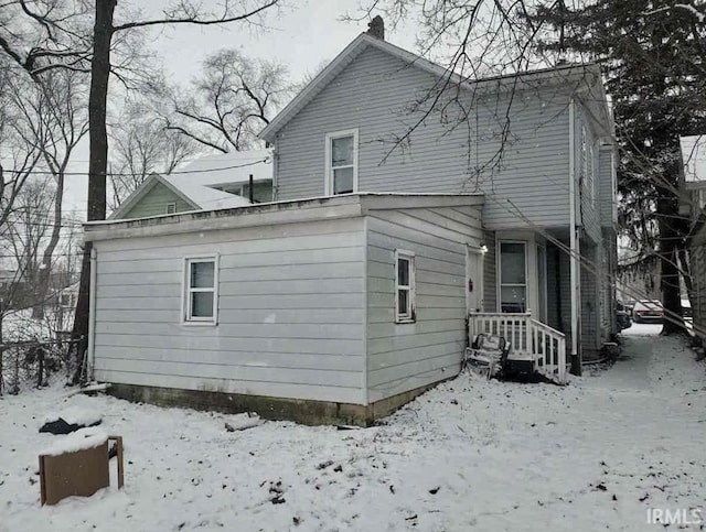 view of snow covered house