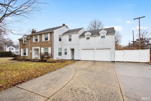 view of front of home featuring a front yard and a garage