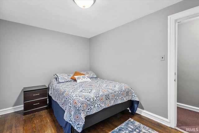 bedroom featuring dark hardwood / wood-style flooring