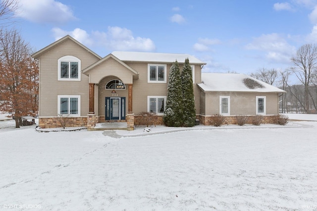 split foyer home with stone siding