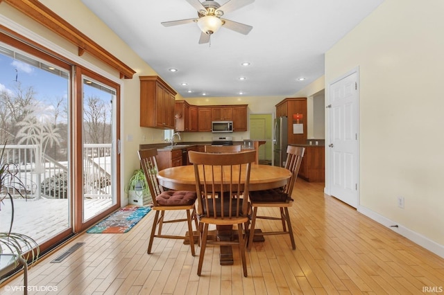 dining room featuring light wood finished floors, baseboards, visible vents, ceiling fan, and recessed lighting