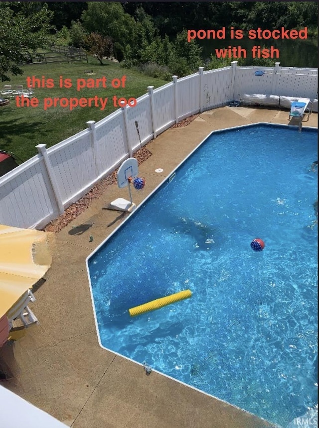 view of pool with fence and a fenced in pool