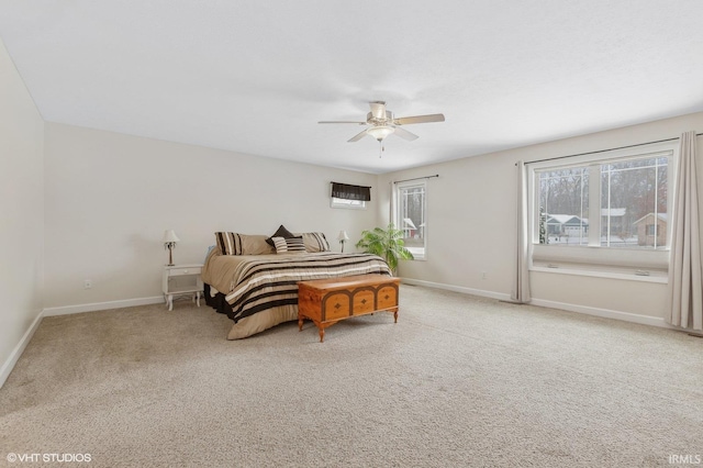 bedroom featuring ceiling fan, carpet flooring, and baseboards