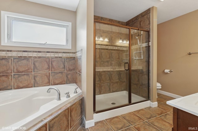 bathroom with vanity, a stall shower, tile patterned flooring, and a bath