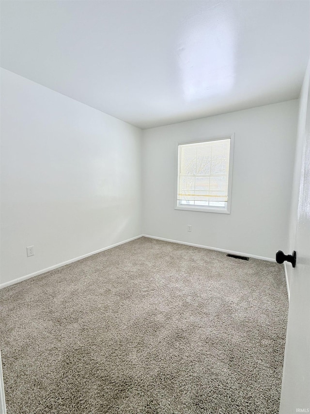 unfurnished room with carpet floors