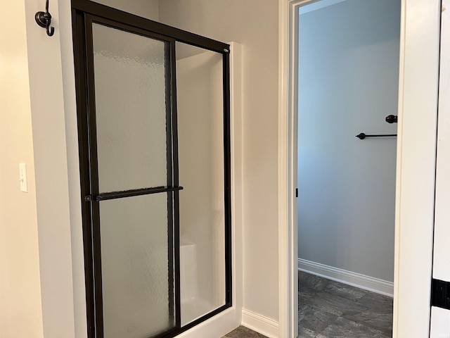 bathroom featuring an enclosed shower