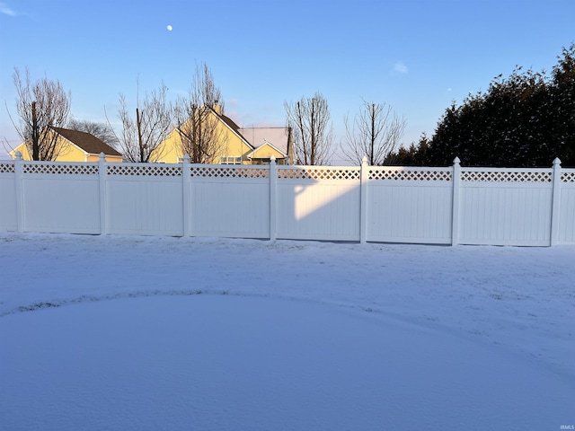 view of snow covered gate