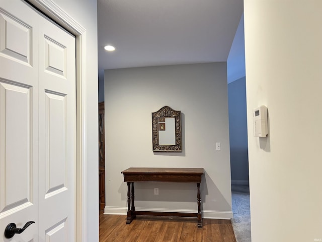 hallway with wood-type flooring