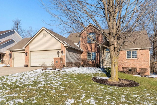 view of front of home with a garage and a lawn