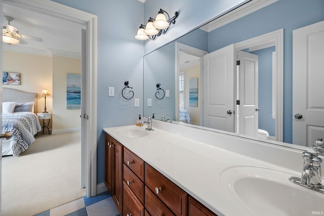 bathroom featuring vanity, toilet, ceiling fan, and crown molding