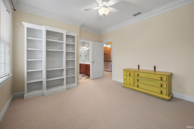 interior space with carpet flooring, ceiling fan, and ornamental molding