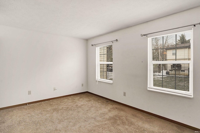 spare room featuring carpet floors