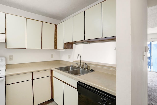 kitchen with sink, black dishwasher, light colored carpet, a textured ceiling, and white cabinets