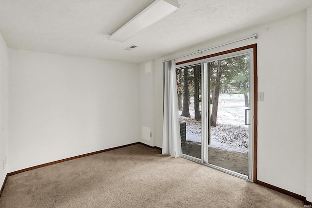 spare room featuring carpet floors