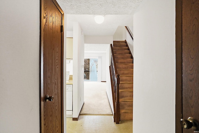 corridor with a textured ceiling