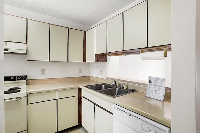 kitchen with white appliances, a textured ceiling, exhaust hood, sink, and white cabinetry