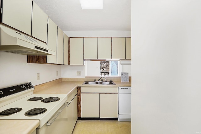 kitchen featuring white appliances and sink