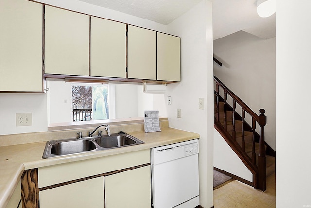 kitchen with white dishwasher and sink