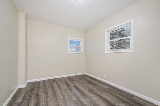 empty room with dark hardwood / wood-style floors