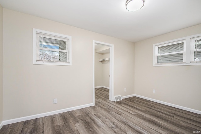 spare room with hardwood / wood-style floors