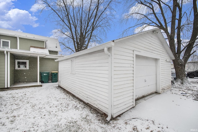 view of snow covered garage