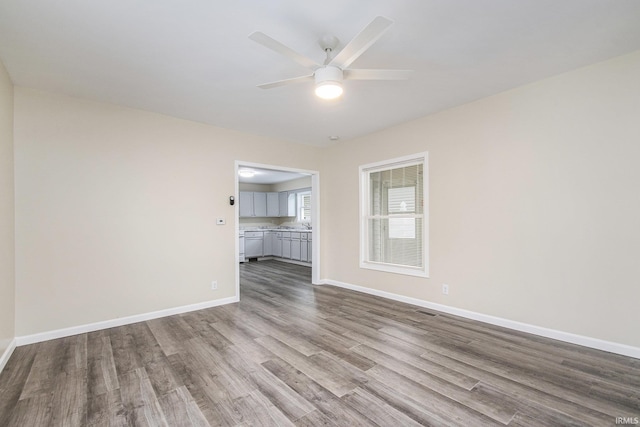 unfurnished living room with light hardwood / wood-style flooring and ceiling fan