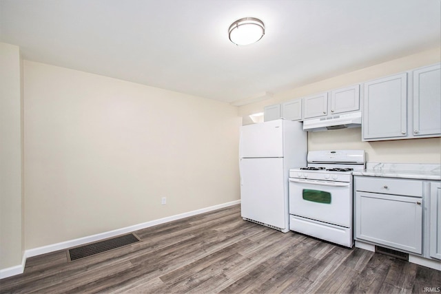 kitchen with white appliances and dark wood-type flooring