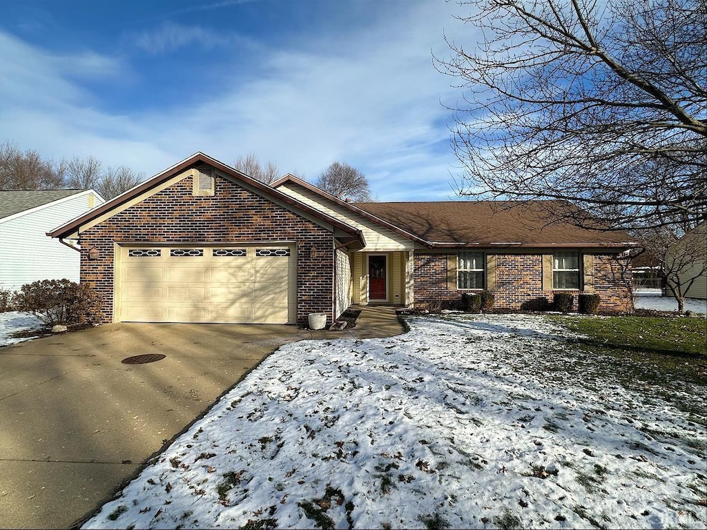 ranch-style house featuring a garage