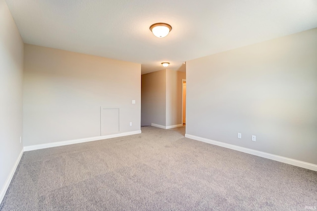 spare room featuring carpet floors