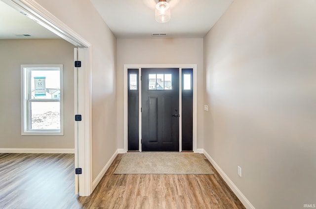 entryway with light hardwood / wood-style flooring