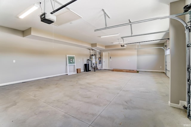 garage featuring a garage door opener and water heater