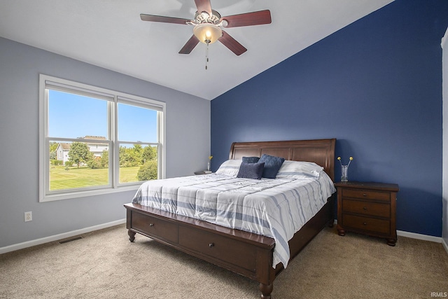 carpeted bedroom with ceiling fan and lofted ceiling