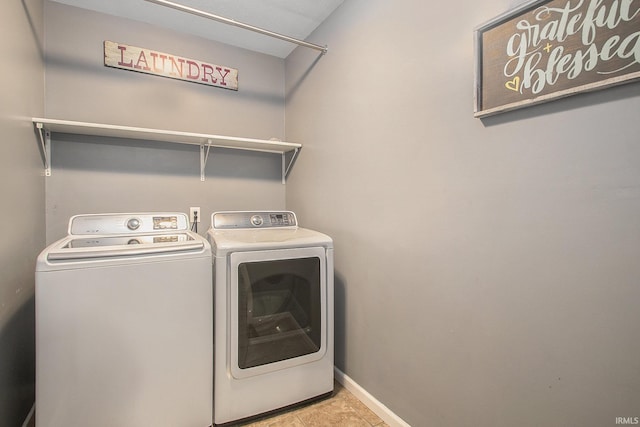 washroom featuring independent washer and dryer and light tile patterned floors